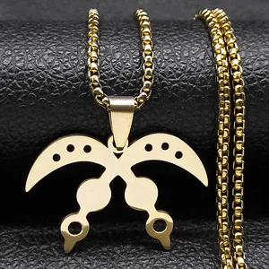 Polished gold Akofena sword pendant necklace with box chain on black leather background
