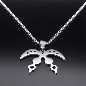 Macro shot of silver stainless steel Akofena sword pendant with detailed hollow craftsmanship
