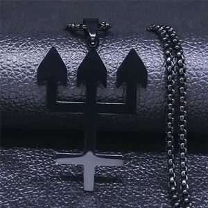 Close-up of black polished trident cross pendant with beaded chain on leather background