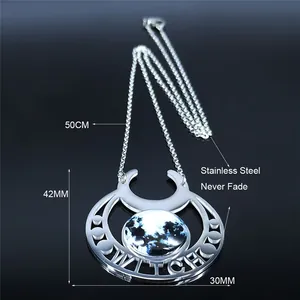 Stainless steel crescent moon witch pendant necklace with nebula stone on dark surface