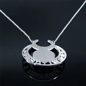 Polished stainless steel moon pendant necklace featuring a cutout witch motif and silver chain