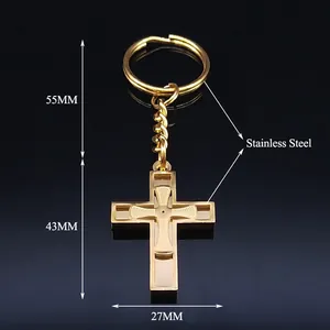 Golden stainless steel cross keychain with geometric engraved patterns and links