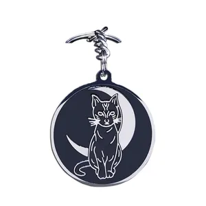 Artistic crescent moon and cat stainless steel keychain with black and white enamel detail