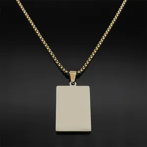 Polished 18k gold plated stainless steel necklace with rectangular pendant on black background