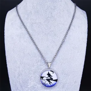Macro detail of silver wheat chain and magic cat silhouette pendant on gray stand