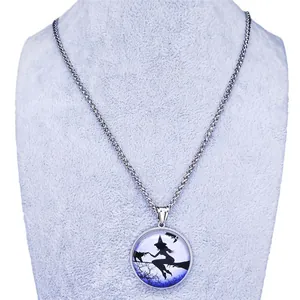 Fantasy witch and cat silhouette on moonlit blue glass pendant with stainless steel chain