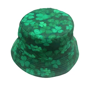 Detailed view of reinforced stitching and clover print on the green reversible bucket hat