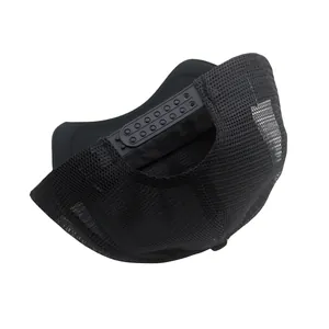 Detail view of the breathable mesh back and adjustable snapback closure on a black trucker hat