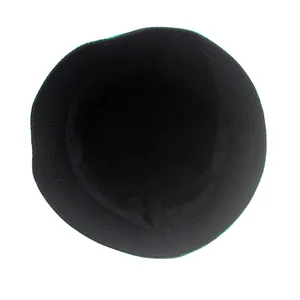 Detailed top view of reversible four-leaf clover bucket hat with green brim and black lining