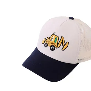 Detail of embroidered yellow excavator pattern on kids mesh baseball trucker cap