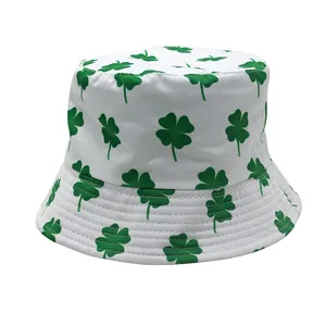 White reversible bucket hat with green shamrock clover print for St. Patrick's Day style
