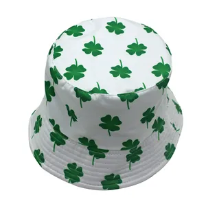 Reversible bucket hat with green four-leaf clover print on white cotton canvas