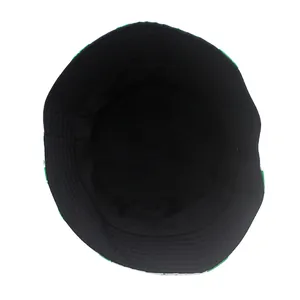 Detail view of reversible clover print bucket hat showing stitching and inner black fabric