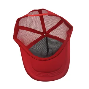 Detail view of red mesh trucker hat interior with adjustable plastic strap and mesh panel