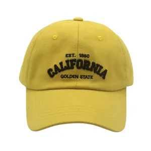 Close-up of California golden state embroidery on yellow cotton twill baseball cap