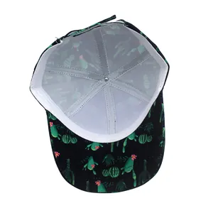 Internal view of a black baseball cap with green cactus print and adjustable strap