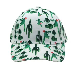 Close-up of white baseball cap with green cactus prints and small pink floral details