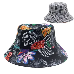 Women's wide brim sun hat with reversible tropical leaf print and plaid patterns