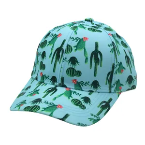 Close-up of light blue canvas baseball cap with green cactus pattern and pink floral details