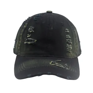 Detailed macro of distressed black washed cotton baseball cap with vintage frayed holes