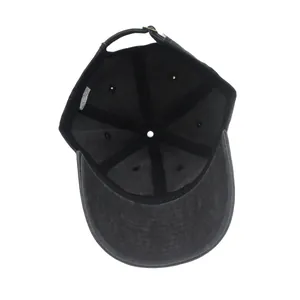 Detail of washed cotton baseball cap interior showing stitching and metal buckle