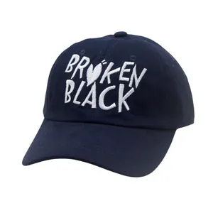 Navy blue baseball cap with white Broken Black embroidery and a curved visor for sun protection