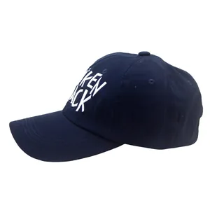 Detail of dark blue baseball cap featuring high-quality white KEN JACK 3D embroidery