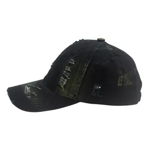 Detailed view of distressed black cotton baseball cap with vintage frayed hole design