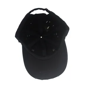 Detail view of the black baseball cap showing internal structure and adjustable buckle