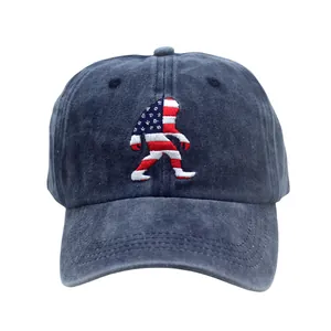 Detail of American flag Bigfoot embroidery on navy washed cotton vintage baseball cap