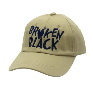 Detailed embroidery of BROKEN BLACK text and heart on khaki canvas baseball cap