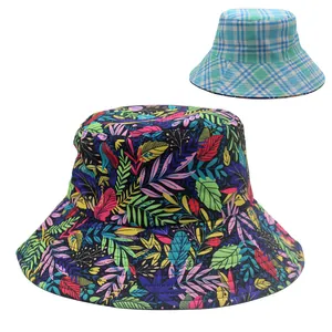 Detail of wide brim bucket hat with colorful tropical leaf print and plaid patterns