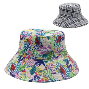 Detail of wide-brim sun hat with colorful leaf print and classic grey plaid pattern