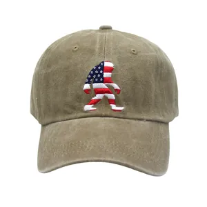 Macro detail of Bigfoot embroidery with US flag pattern on washed cotton baseball cap