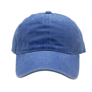 Macro detail of washed blue cotton twill texture and stitching on a six-panel baseball cap