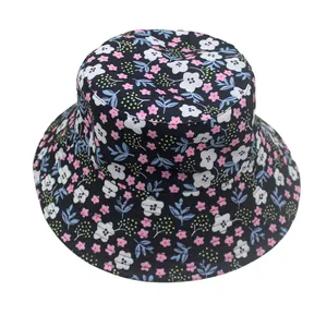 Detailed top view of a wide brim sun hat featuring floral and blue leaf prints on black