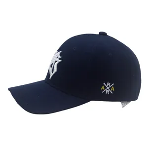 Detail view of navy blue polyester baseball cap with 3D white embroidered letter logo