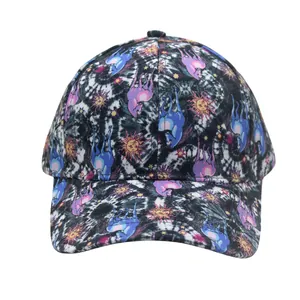 Detail of baseball cap with tie-dye patterns and blue unicorn prints on breathable fabric