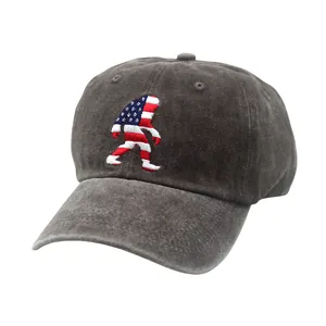 Macro detail of the Sasquatch embroidery with American flag pattern on a gray cap