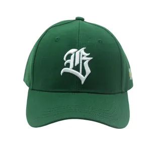 Detailed view of white gothic letter embroidery on dark green cotton baseball cap texture