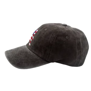 Macro detail of embroidered American flag on vintage washed gray cotton baseball cap
