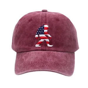 Close-up of vintage burgundy washed cotton baseball cap with American flag Bigfoot embroidery