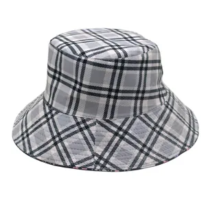 Detailed close-up of a grey plaid bucket hat showing reinforced stitching on the wide brim