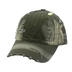 Close-up of distressed vintage baseball cap showing fabric texture and rip details