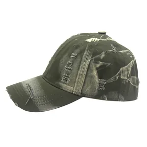 Close-up of distressed vintage baseball cap showing ripped details and washed fabric