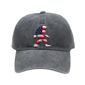 Detail of embroidered bigfoot silhouette with American flag pattern on a gray washed cotton cap