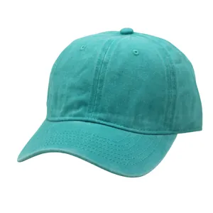 Detailed view of teal washed cotton baseball cap with vintage distressed texture and stitching