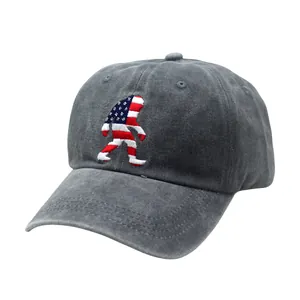 Macro detail of Bigfoot embroidery with US flag pattern on washed cotton baseball cap