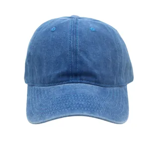 Detail view of washed navy blue cotton baseball cap with ventilation eyelets and stitching