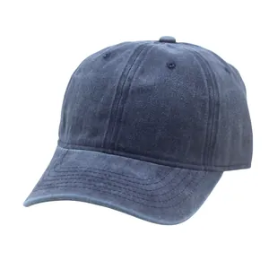Detail of washed cotton fabric texture and stitching on dark blue baseball cap